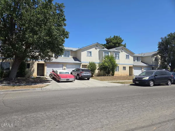 a view of a car park in front of house