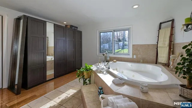 a bathroom with a tub and shower