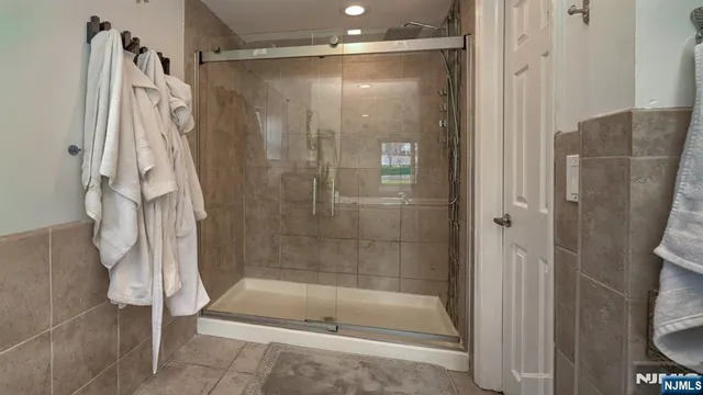 a bathroom with a shower and a tub