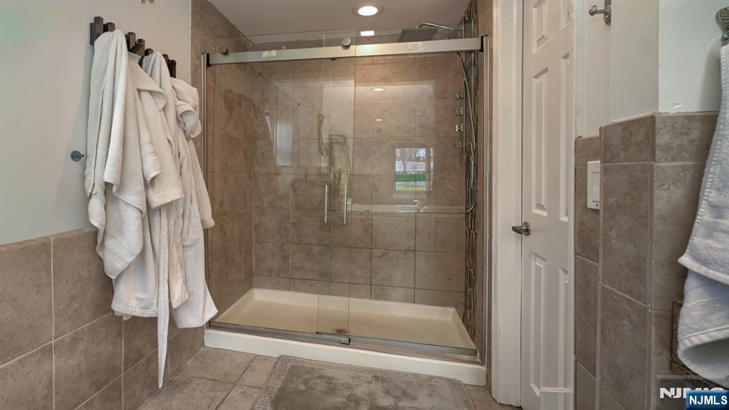 224 Pompton Road Haledon, NJ 07508 - Photo 23 of 34 a bathroom with a shower and a tub