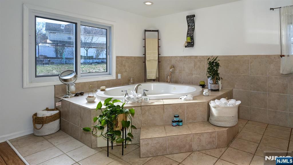 224 Pompton Road Haledon, NJ 07508 - Photo 24 of 34 a bath room with a sink and a potted plant