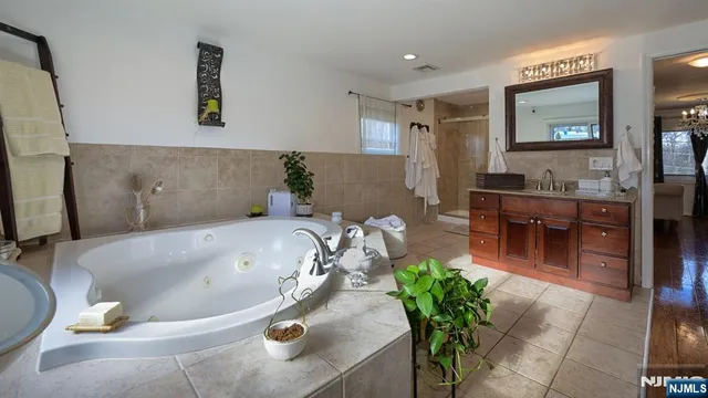 a bath tub sitting in a bathroom and sink