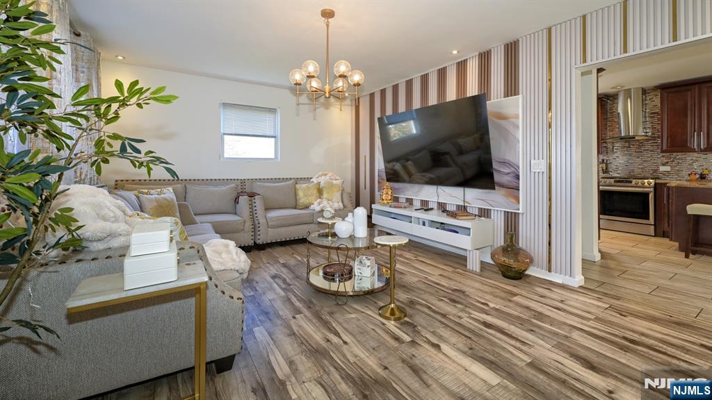 224 Pompton Road Haledon, NJ 07508 - Photo 6 of 34 a living room with furniture and a flat screen tv