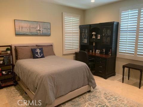 74 Nassau Irvine, CA 92620 - Photo 13 of 17 a bedroom with a bed and walk in closet