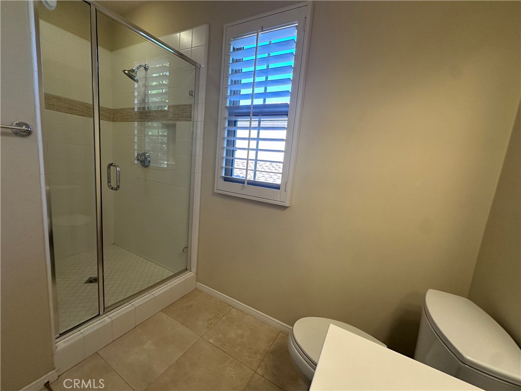 74 Nassau Irvine, CA 92620 - Photo 15 of 37 a bathroom with a toilet and shower