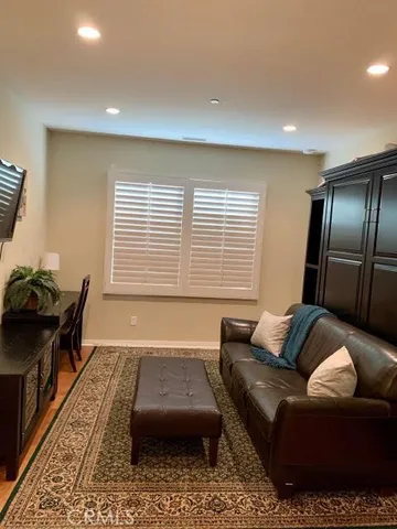 a living room with a couch and a window