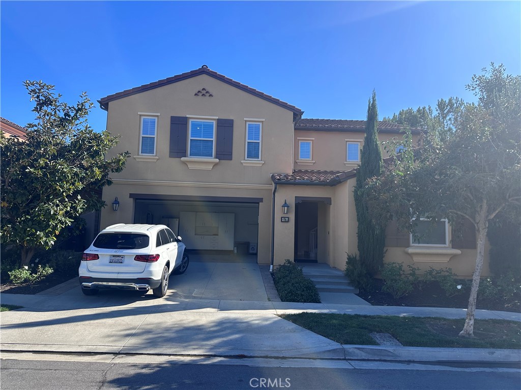 74 Nassau Irvine, CA 92620 - Photo 18 of 37 a car parked in front of a house