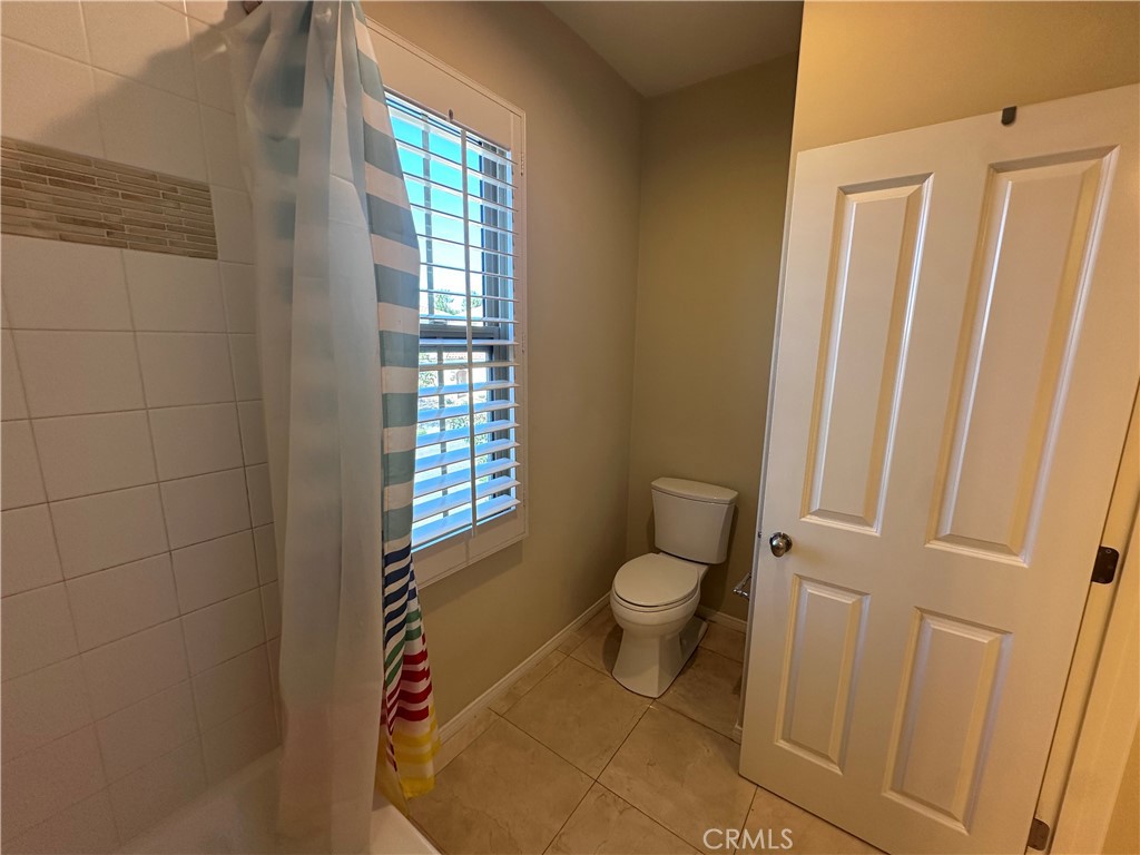 74 Nassau Irvine, CA 92620 - Photo 29 of 37 a bathroom with a toilet a sink and a window