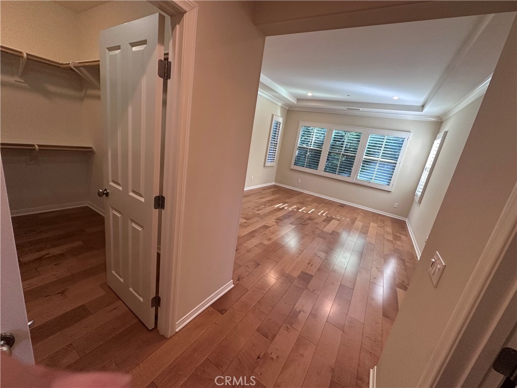 74 Nassau Irvine, CA 92620 - Photo 36 of 37 an empty room with wooden floor and windows