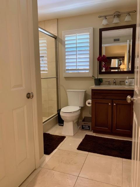 74 Nassau Irvine, CA 92620 - Photo 7 of 17 a bathroom with a toilet a sink and a mirror