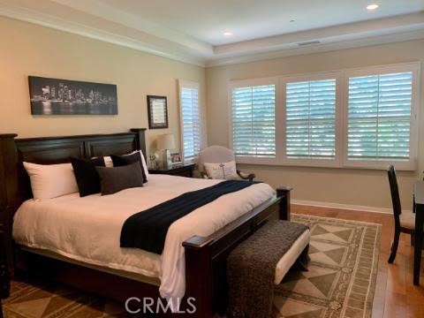 74 Nassau Irvine, CA 92620 - Photo 9 of 17 a bedroom with a bed and wooden floor