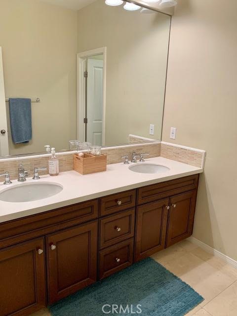 74 Nassau Irvine, CA 92620 - Photo 10 of 17 a bathroom with a sink and a mirror