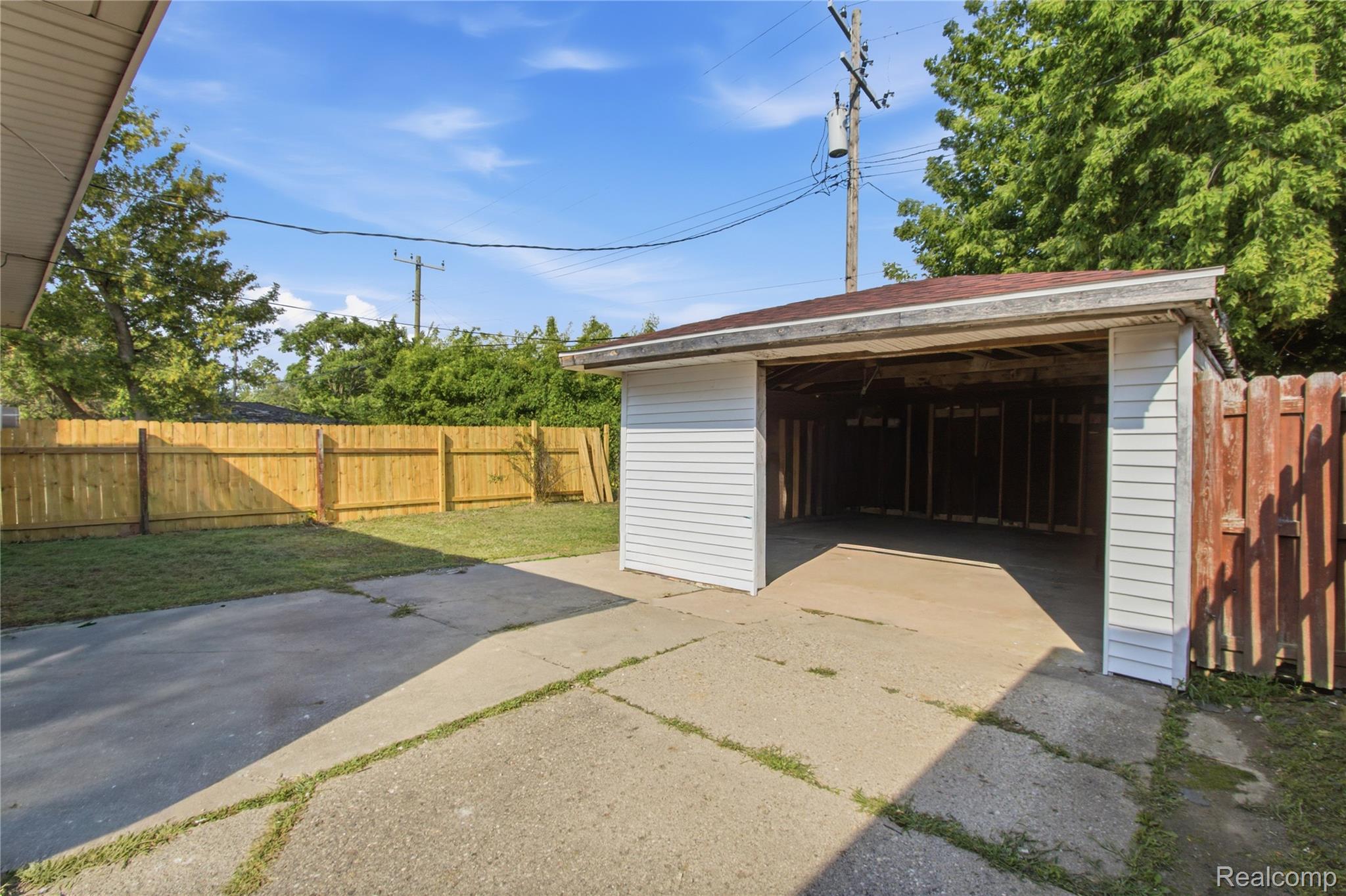 17544 Evergreen Road Detroit, MI 48219 - Photo 15 of 16 Detached garage with overhead door and concrete driveway apron