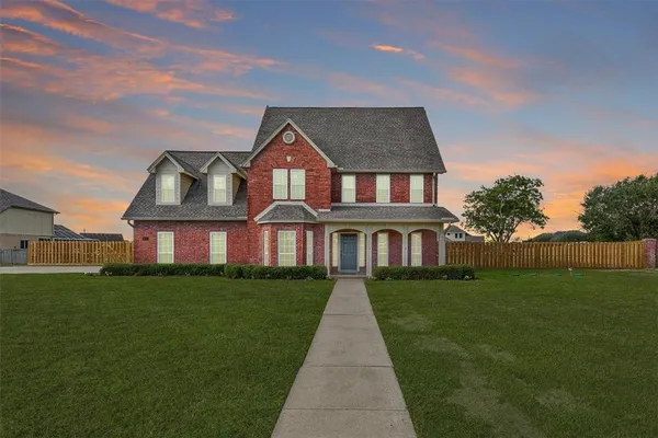 a front view of a house with yard