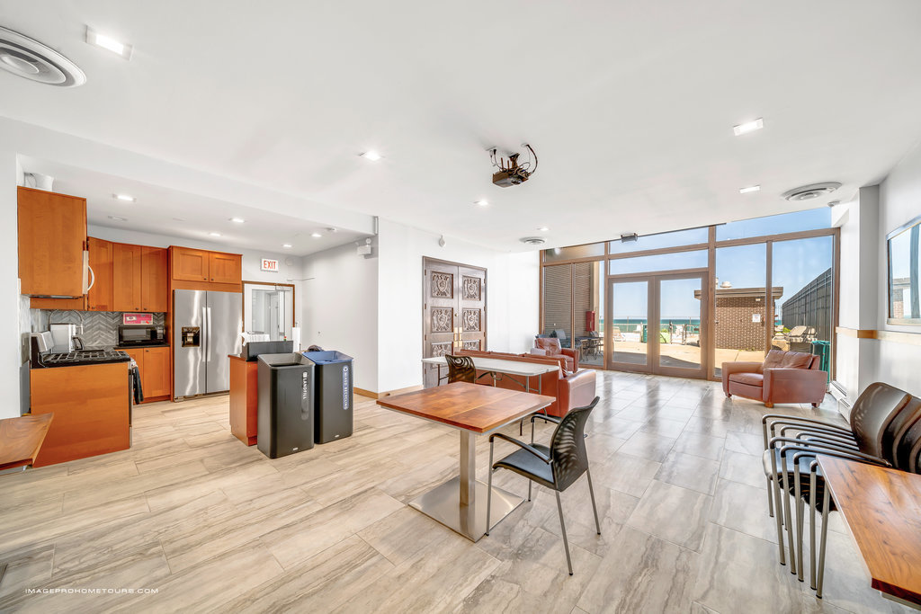 6325 North Sheridan Road, Unit 1903 Chicago, IL 60660 - Photo 15 of 20 a living room with furniture and a large window