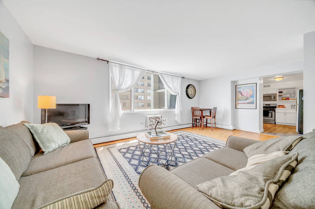 6325 North Sheridan Road, Unit 1903 Chicago, IL 60660 - Photo 4 of 20 a living room with furniture and a window
