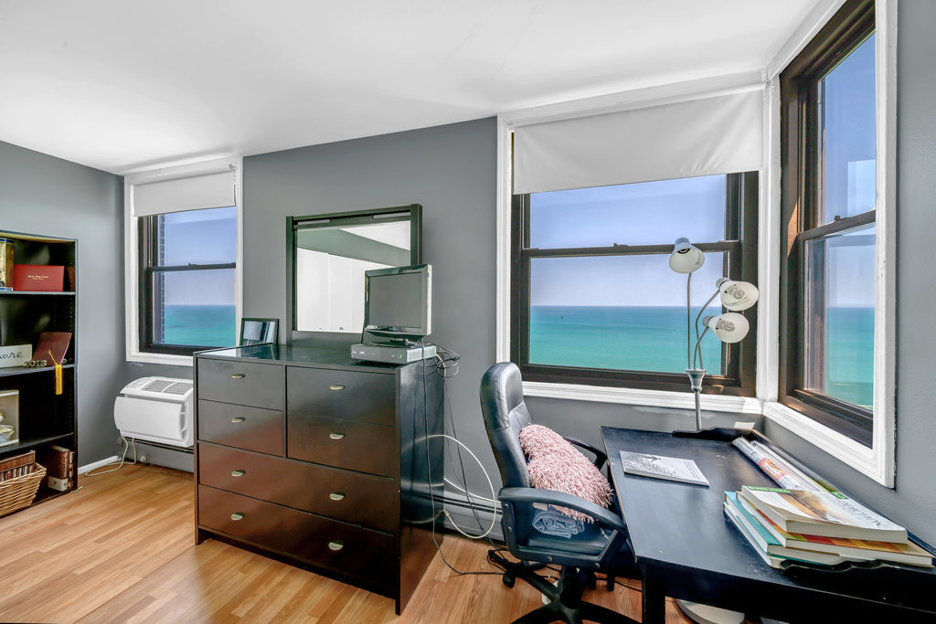 6325 North Sheridan Road, Unit 1903 Chicago, IL 60660 - Photo 7 of 20 a living room with furniture and a window