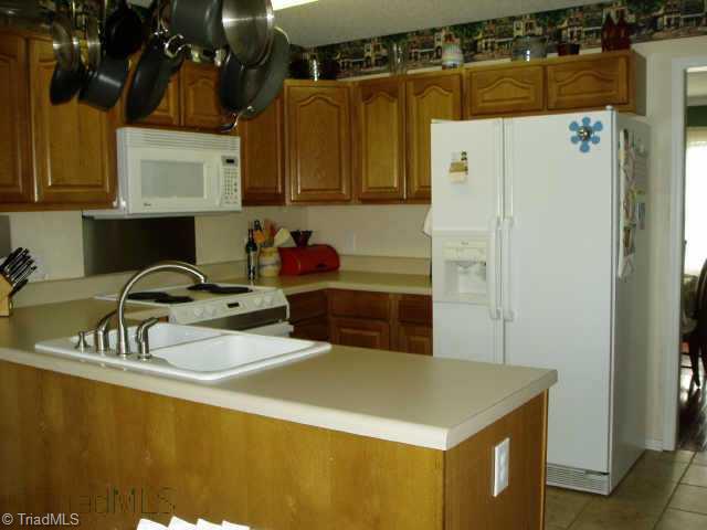 7836 Clinard Farms Road High Point, NC 27265 - Photo 7 of 9 Other. Spacious Kitchen with Plenty of Cabinet Space. Newer Sink and Fixtures