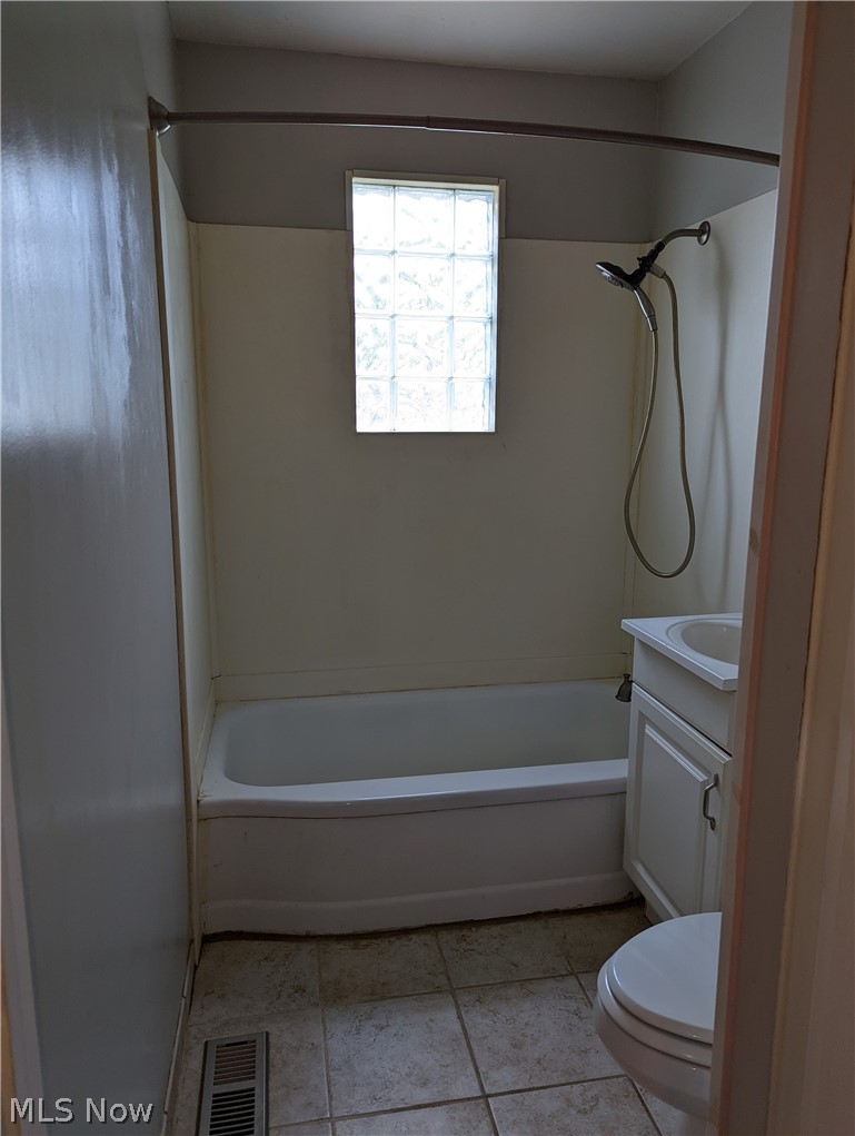 13817 Granger Road Cleveland, OH 44125 - Photo 11 of 22 First-floor bathroom with glass block window