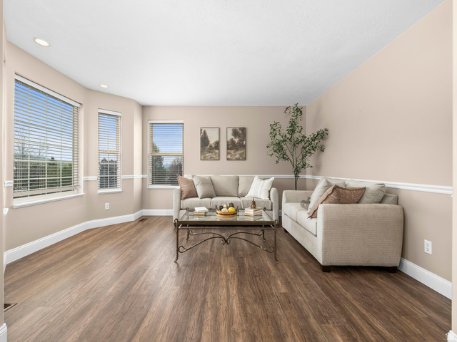6849 North Black Powder Road Mountain Green, UT 84050 - Photo 5 of 43 Spacious living area featuring wood-finish flooring, recessed lighting, and a chair rail molding