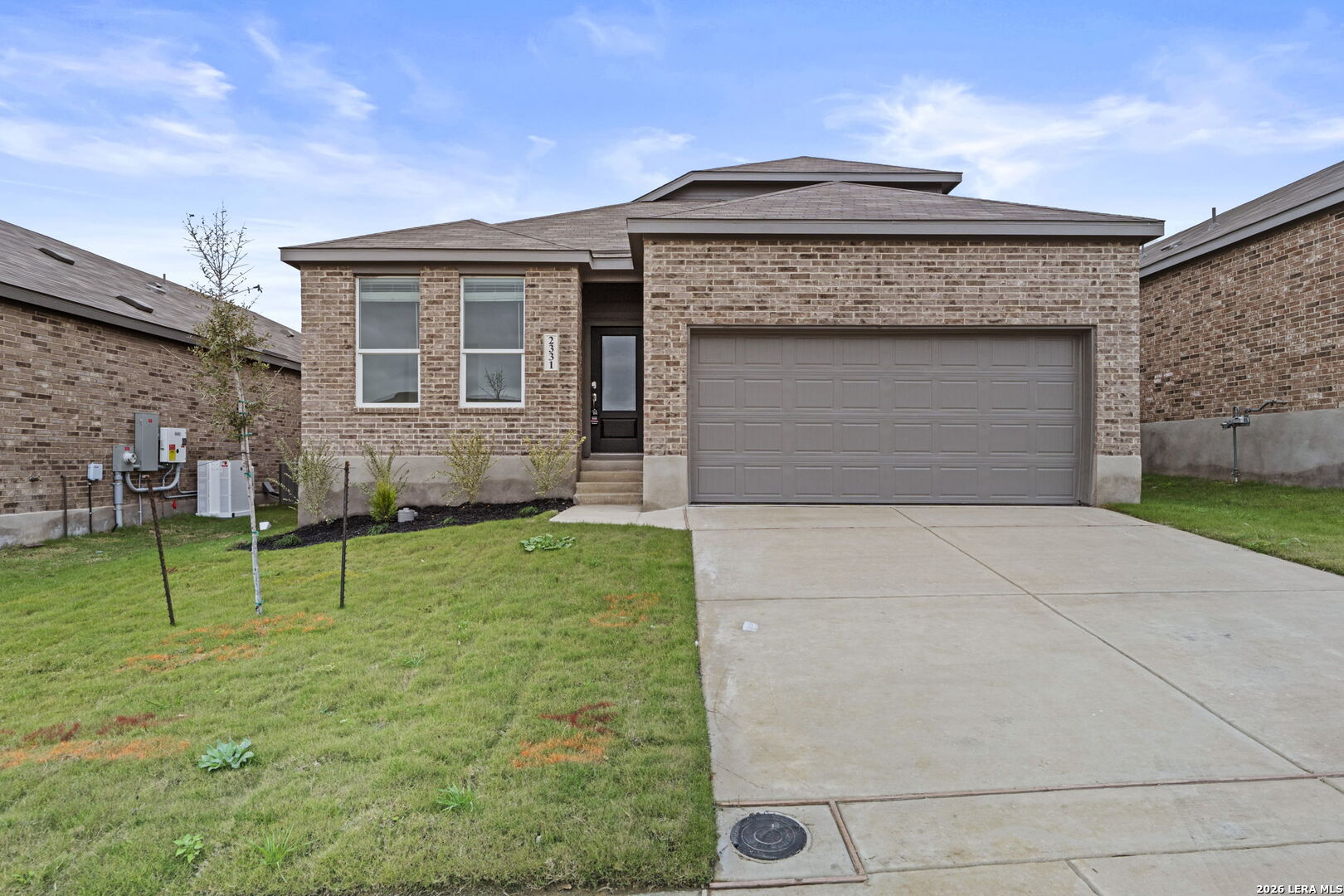 a front view of a house with a yard