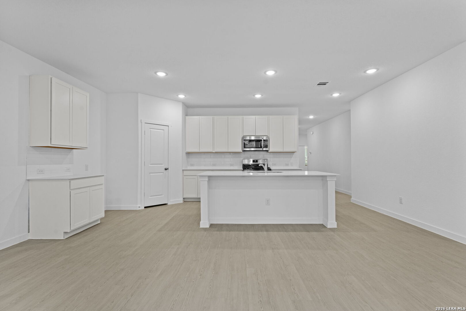 2331 Fort Davis Pass Marion, TX 78124 - Photo 17 of 28 a view of a kitchen with white cabinets