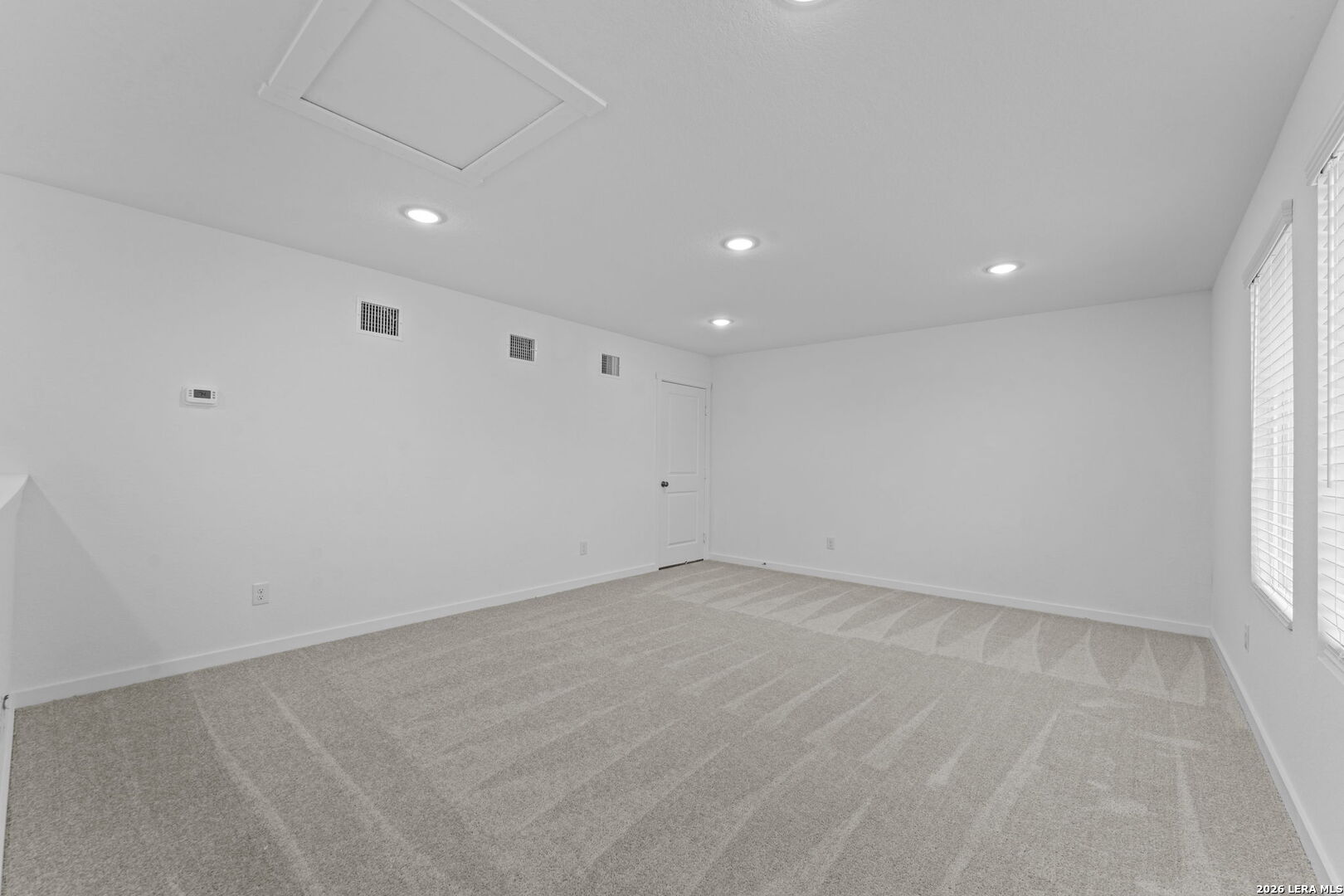 2331 Fort Davis Pass Marion, TX 78124 - Photo 25 of 28 wooden floor in an empty room with a window