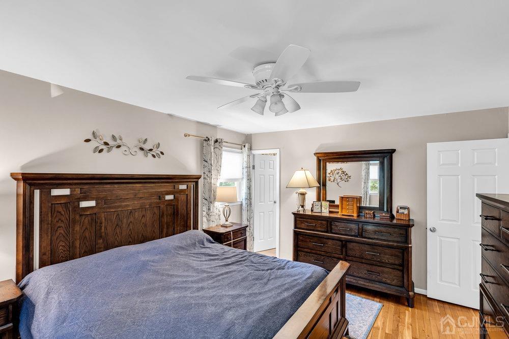 24 Chandler Road Edison, NJ 08820 - Photo 15 of 30 a bedroom with a bed and a dresser