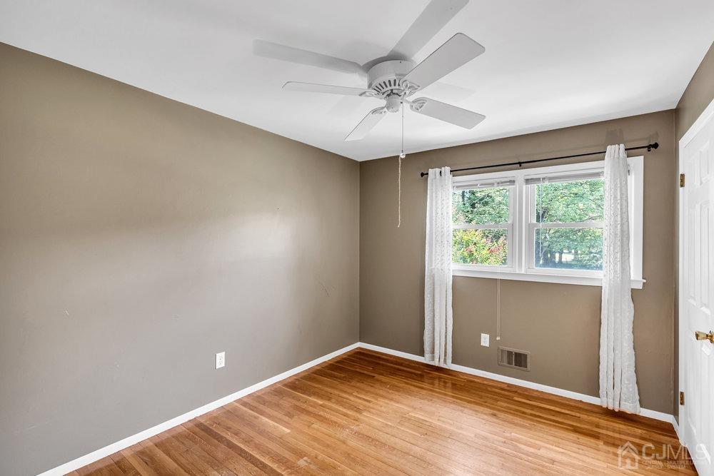 24 Chandler Road Edison, NJ 08820 - Photo 19 of 30 a view of room with window and ceiling fan