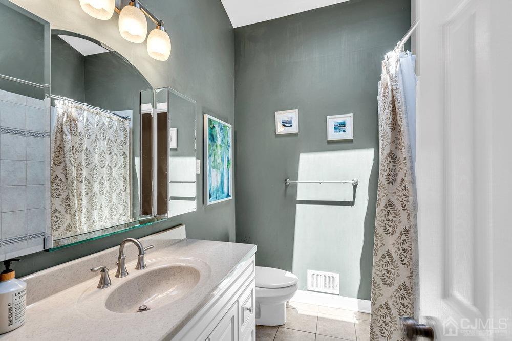 24 Chandler Road Edison, NJ 08820 - Photo 20 of 30 a bathroom with a sink toilet and shower