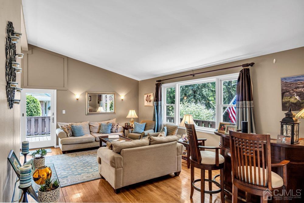 24 Chandler Road Edison, NJ 08820 - Photo 2 of 30 a living room with furniture and a large window