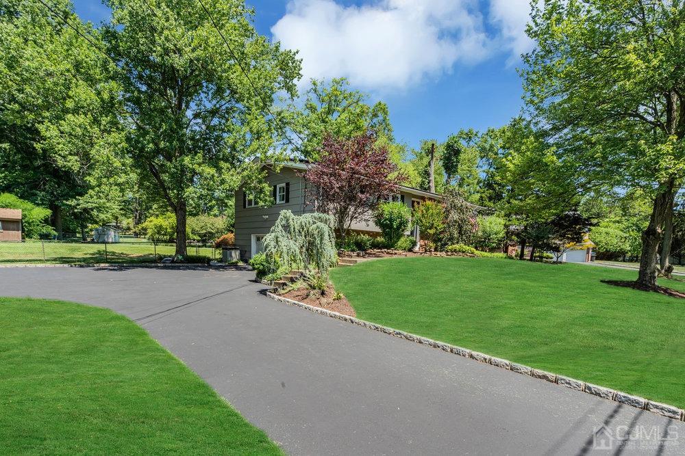 24 Chandler Road Edison, NJ 08820 - Photo 30 of 30 a view of a street with a building and trees in the background