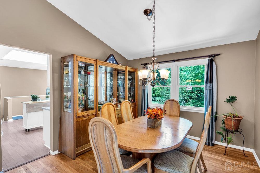 24 Chandler Road Edison, NJ 08820 - Photo 10 of 30 a dining room with furniture a chandelier and wooden floor