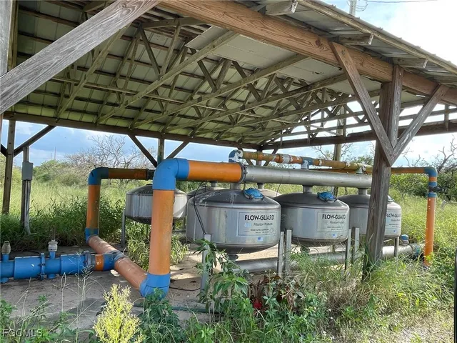 a view of two chairs in a patio