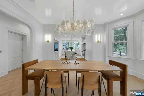 a view of a kitchen with stainless steel appliances granite countertop a sink and a stove top oven