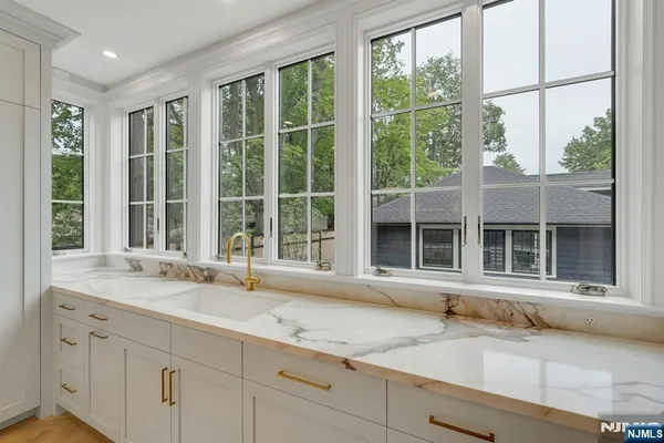 a bathroom with a sink and mirror