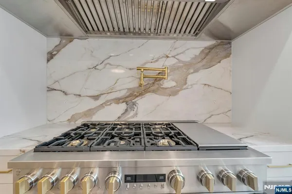 a room with a wooden floor and a window