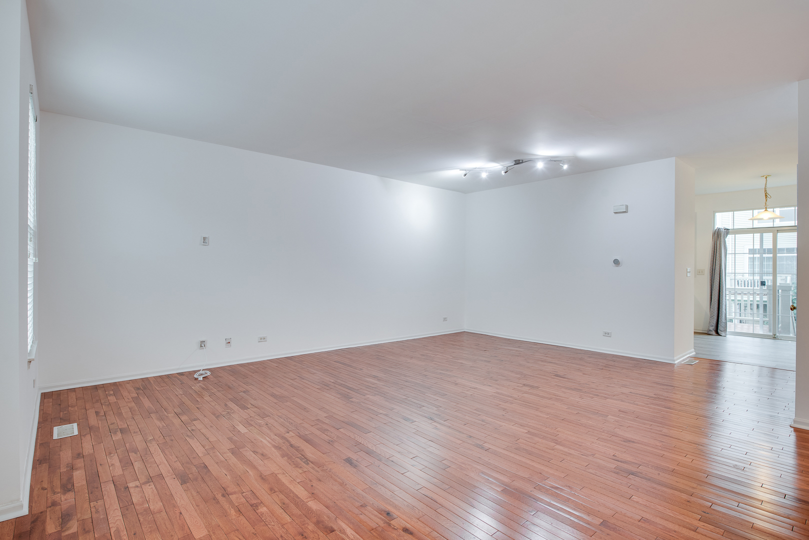 401 North Commerce Street, Unit 401 Aurora, IL 60504 - Photo 16 of 20 a view of an empty room with wooden floor