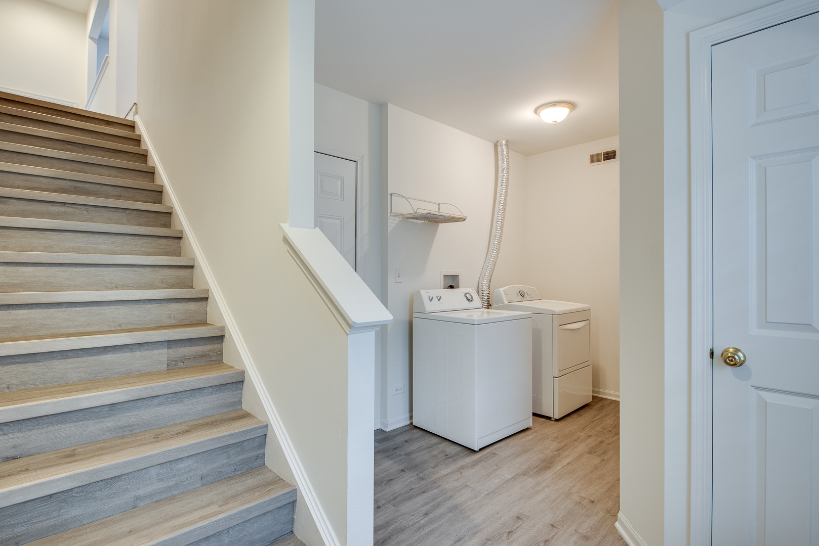 401 North Commerce Street, Unit 401 Aurora, IL 60504 - Photo 18 of 20 a view of entryway and hall with wooden floor