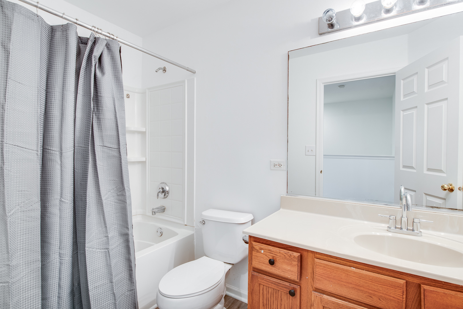 401 North Commerce Street, Unit 401 Aurora, IL 60504 - Photo 6 of 20 a bathroom with a sink a toilet and shower