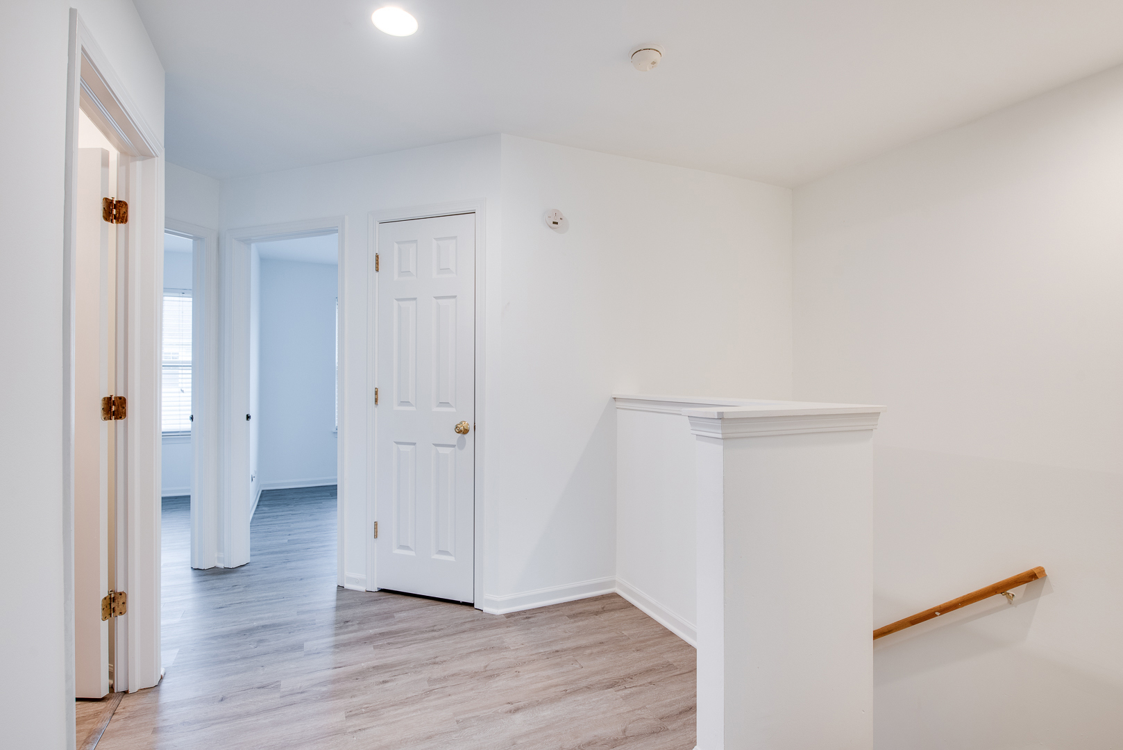 401 North Commerce Street, Unit 401 Aurora, IL 60504 - Photo 7 of 20 a view of a hallway with wooden floor