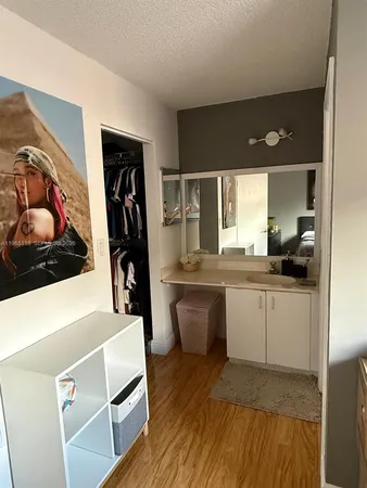 a kitchen with a sink and a refrigerator