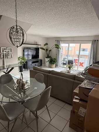 a kitchen with a table and chairs in it