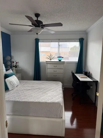 a bedroom with a bed and a table in it