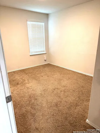 an empty room with a sink
