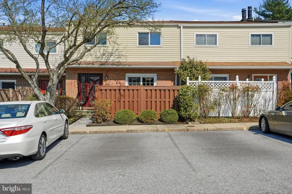 a view of a car park in front of house