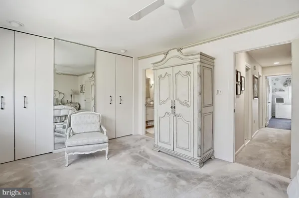 a spacious bathroom with a shower and a glass door