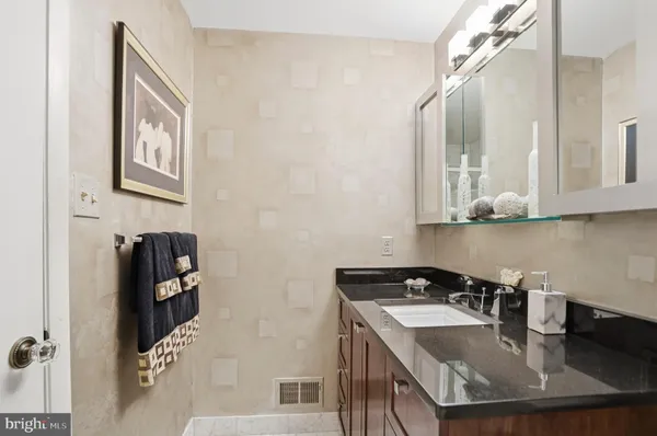a kitchen with a sink a stove and a refrigerator