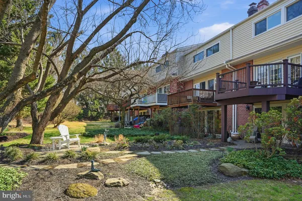 a front view of a building with garden