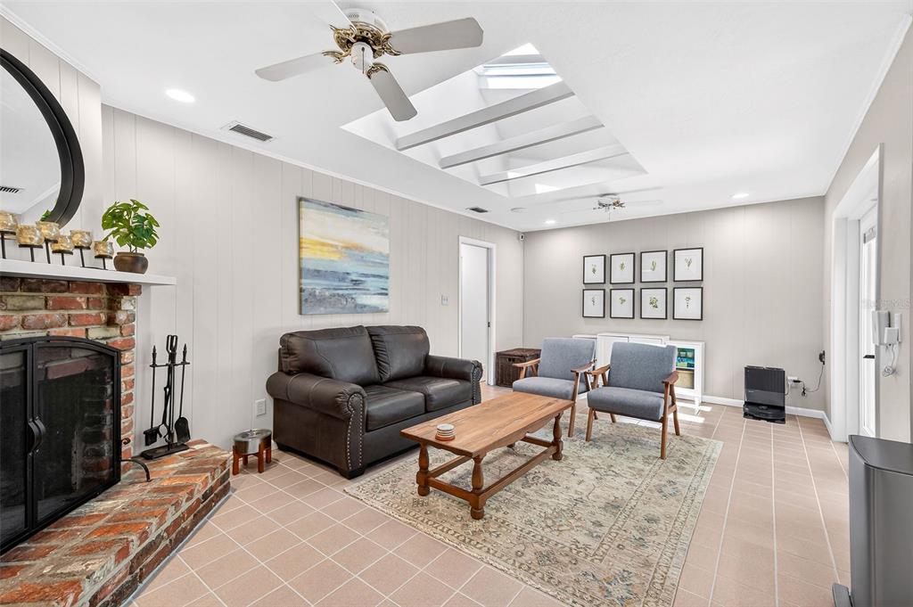 517 Roughbeard Road Winter Park, FL 32792 - Photo 16 of 53 a living room with furniture and a fireplace